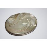 An early 19th century mother-of-pearl and white metal mounted snuff box,