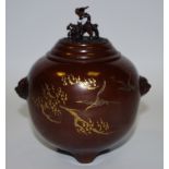 A Japanese brown patinated bronze koro and cover, chased and outlined in gilt with cranes in flight,