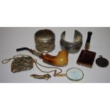 A mother of pearl and meerschaum pipe; a silver mounted cheroot holder; a magnifying glass;