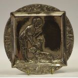 A WMF card tray, embossed with a boy and his dachshunds, model no. 385, ostrich mark, c.