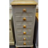 A painted pine tall six drawer chest; a painted pine bedside cabinet,