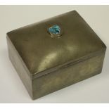 Liberty - a Tudric Pewter cigarette box, hinged cover set with a turquoise cabachon,