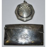 A silver card case;