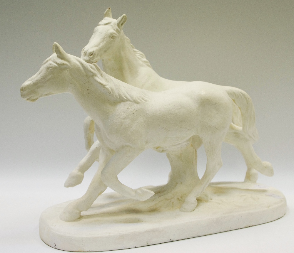 A white painted Spelter model of two horses