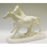 A white painted Spelter model of two horses