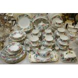 A Booth's Floradora part tea and dinner service comprising teapot, coffee pot, bowls, cups, saucers,