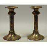 A pair of Elizabeth II silver candlesticks,