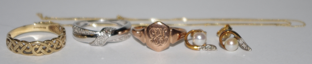 A 9ct rose gold signet ring; a 9ct gold Celtic ring; a 9ct white gold ring,