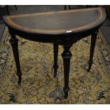 An Ebonised card table satinwood banding