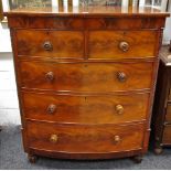 A 19th Century flame mahogany bow front chest oversailing top two short cockbeaded drawers over