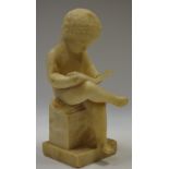 French School (19th century), an alabaster figure, of a putto reading,