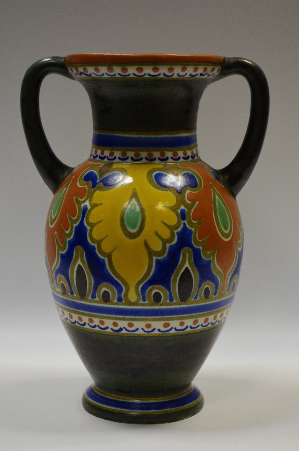 A Gouda art pottery twin handled ewer,