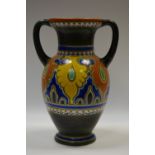 A Gouda art pottery twin handled ewer,