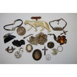 An Aesthetic movement silver brooch; a filigree brooch; other jewellery; watch movements;