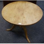 A George III mahogany tilt top table, circular top, turned column, three cabriole legs pad feet,