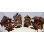 Four Black Forest cuckoo clocks,