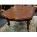 A Victorian mahogany wind out dining table, D end inverted baluster reeded legs,