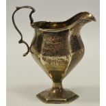 A George V silver pedestal cream jug,