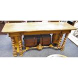 An oak serving table, inverted break front frieze, writhen forelegs,