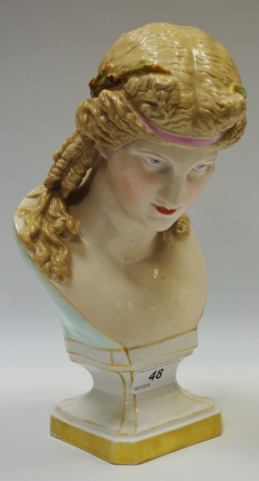 A late 19th century porcelain bust of a classical lady, olive branch head piece,