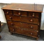 A George III mahogany chest of three short drawers over three graduated drawers,