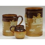 A Royal Doulton salt glazed stoneware mug, typically sprigged in white with jolly topers,