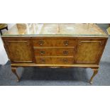 A burr walnut sideboard by Maple, galleried back, carved border, three drawers flanked by cupboards.