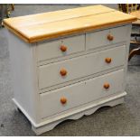 A painted pine chest of two short drawers over two long drawers