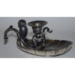 An Art Nouveau period pewter chamberstick, in the manner of WMF, the integral vesta as an owl,