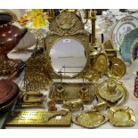 Metal ware - an early 20th century brass looking glass cast with Versace mask floral swags etc.