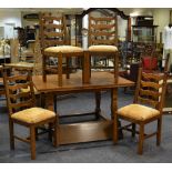 A 1930's country oak extending dining table;