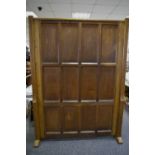 A large oak multi-panelled screen. 216cm high x 157cm wide.