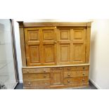 A 19th Century farmhouse scumbled pine housekeeper's cupboard, two panelled sliding doors to top.