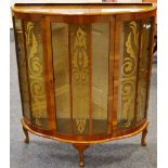 A 1940's bow front walnut veneered display cabinet