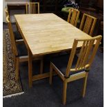 A modern beech dining table with jointed top and six chairs