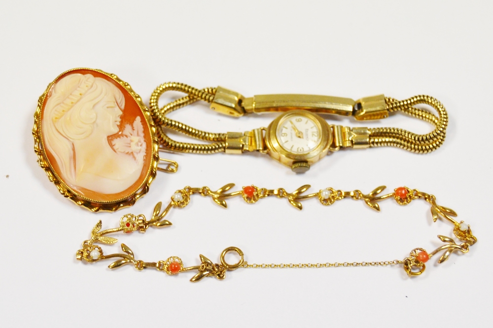 A continental gold bracelet, set with seed pearl and coral stamped 9K 4.