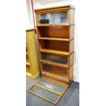 A five tier oak Globe Wernike "Wernike System Elastic" bookcase