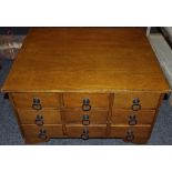 A contemporary mahogany collectors chest of nine drawers