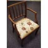 A George III open arm chair, reeded back and arms,