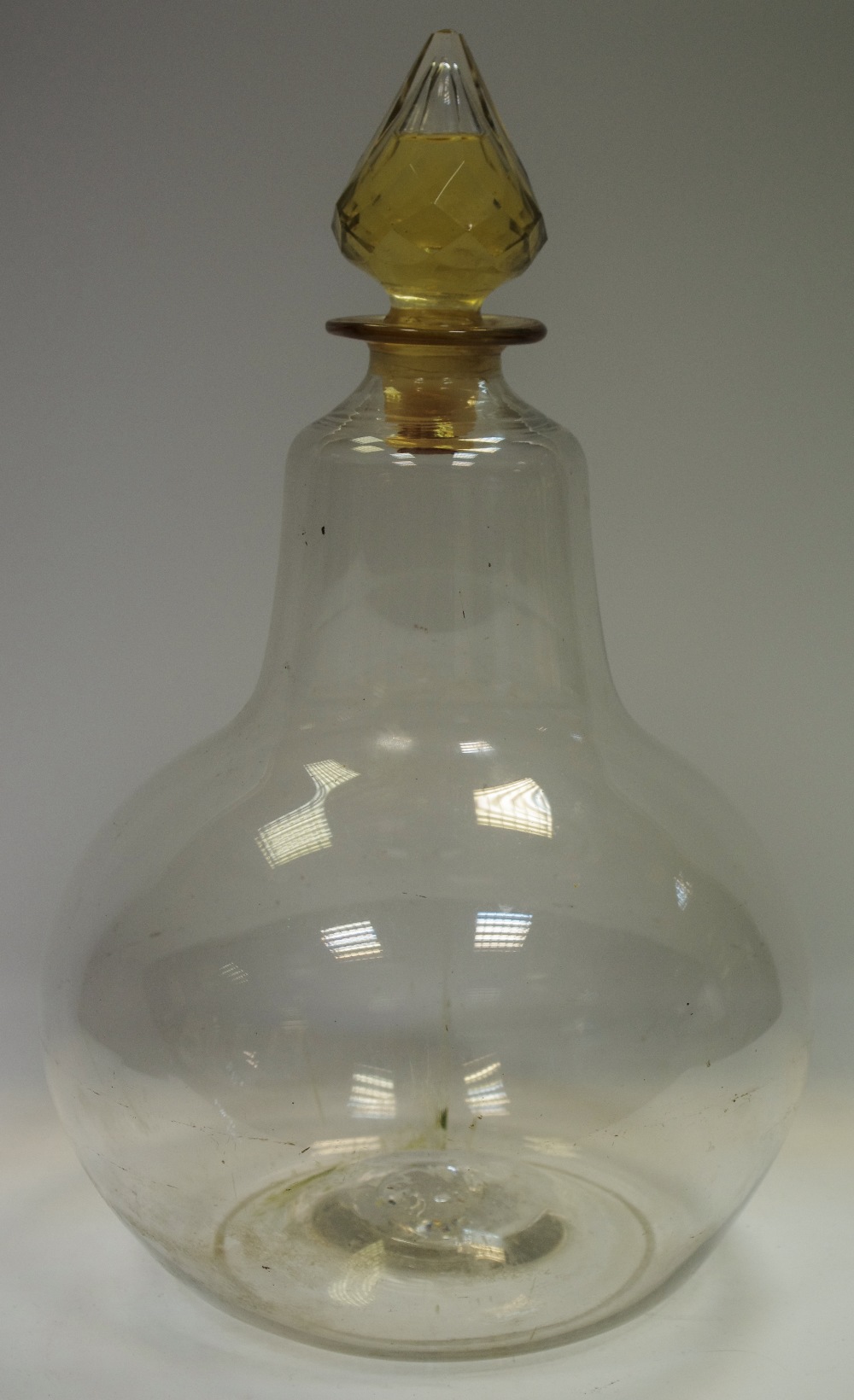 A 19th century blown glass gourd shaped apothecary jar with unusual liquid filled stopper