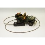 An Arnold tinplate remote controlled clockwork USA Military 002500 complete with three MP's, driver,