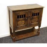 A 19th century oak credence/open glass cupboard constructed with earlier timbers,