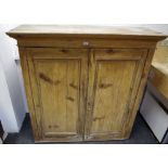 A 19th century country farmhouse pine kitchen cabinet, two doors enclosing shelving 129.