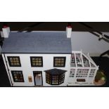 A dolls houses five rooms and conservatory,