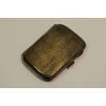 A George V silver rounded rectangular cigarette case, engine turned,