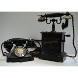 An early 20th century wind up telephone, with anodised metal and bakelite handle, wooden base,
