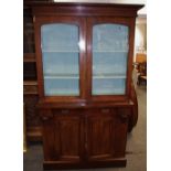 A mahogany bookcase cabinet, two glazed doors to top,