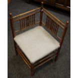 An early Victorian child's corner chair, with turned finials above turned spindled back,