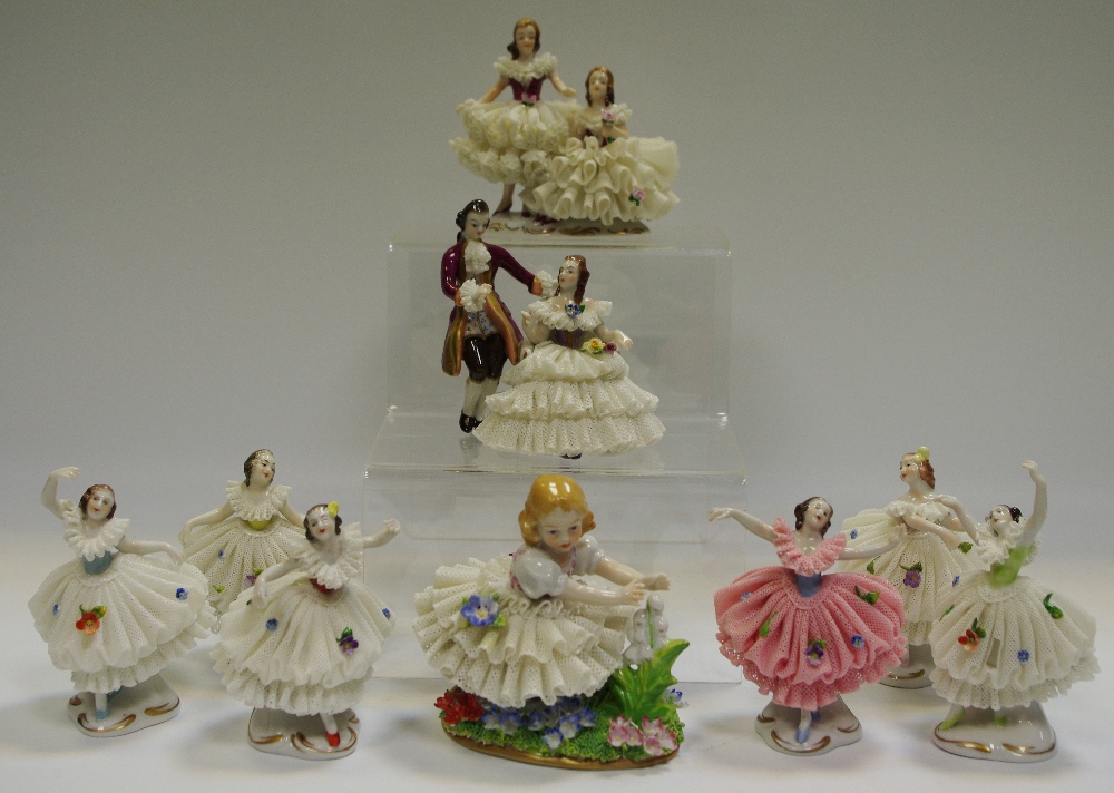 A Dresden type figure of ballerinas with crinoline dresses,