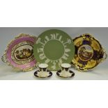 Two 19th Century continental porcelain shaped cabinet plates hand painted with country house scenes;